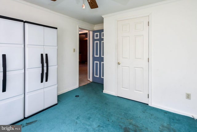 unfurnished bedroom with carpet floors, ornamental molding, ceiling fan, and a closet