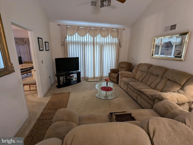 living room featuring lofted ceiling, light colored carpet, and ceiling fan