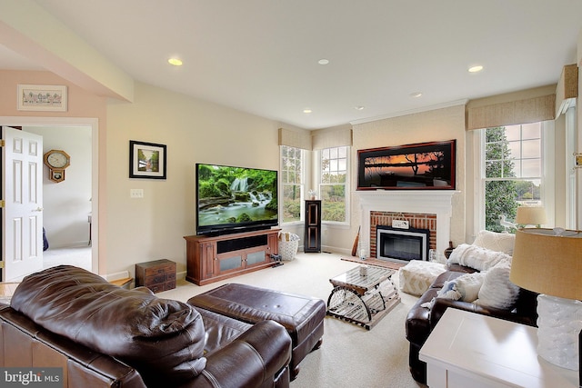 living room featuring light carpet, plenty of natural light, and a fireplace