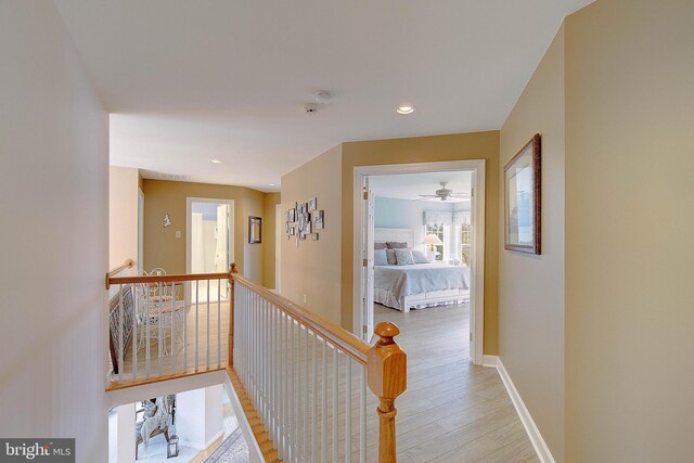 corridor featuring light hardwood / wood-style floors