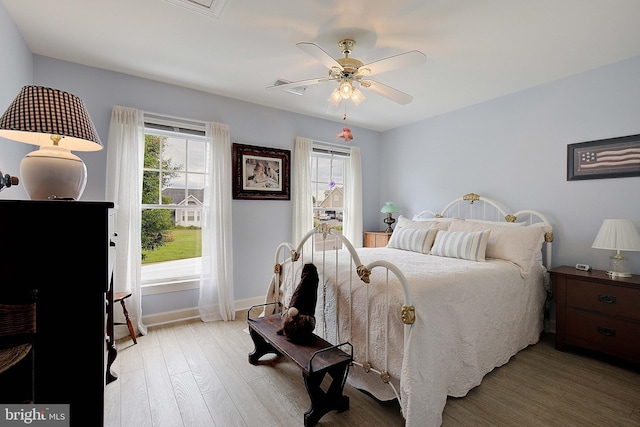 bedroom featuring light hardwood / wood-style flooring and ceiling fan