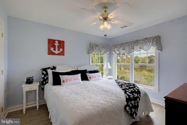 bedroom featuring hardwood / wood-style floors and ceiling fan