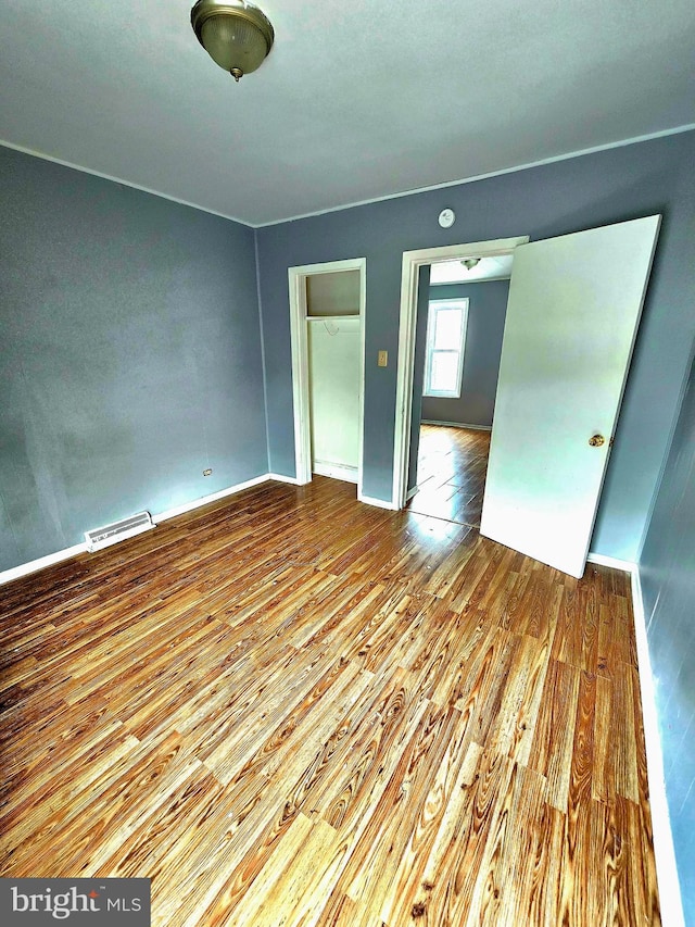 spare room featuring light hardwood / wood-style floors