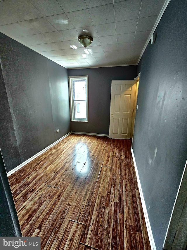 spare room with hardwood / wood-style flooring