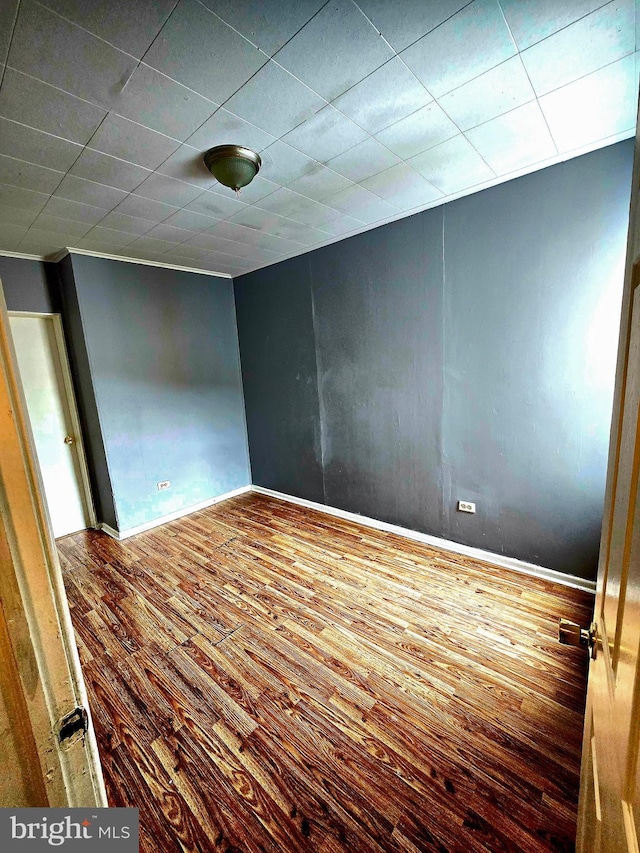 empty room with wood-type flooring