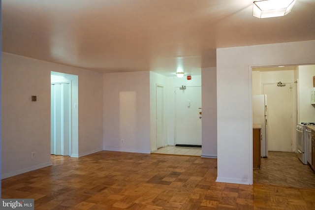 spare room with light parquet floors