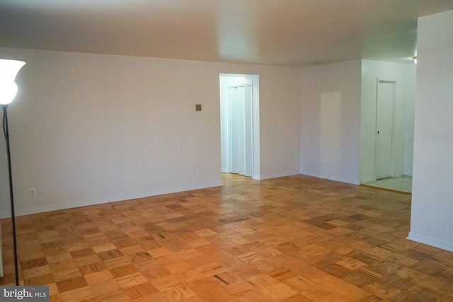 unfurnished room with light parquet floors