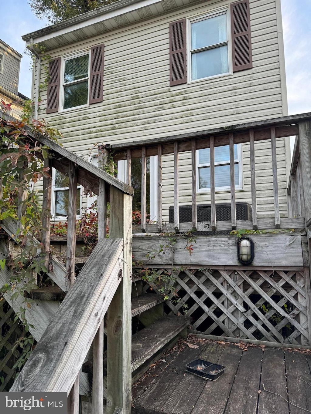 rear view of property with a deck