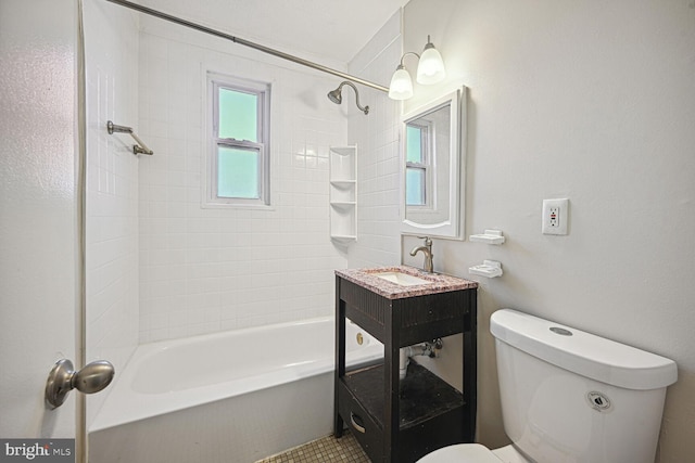 full bathroom with tiled shower / bath combo, vanity, and toilet