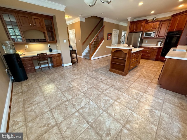 kitchen with stainless steel fridge, white microwave, built in desk, a kitchen island, and black oven