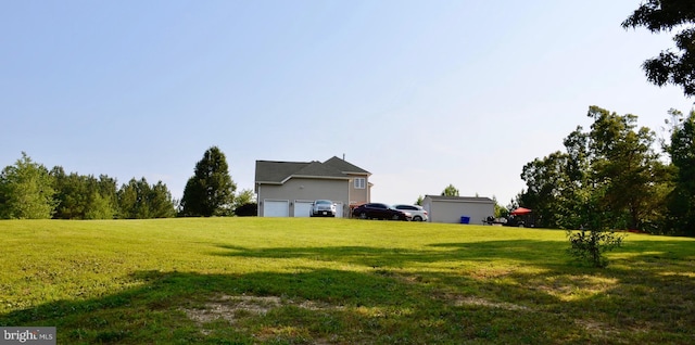 view of yard with a garage