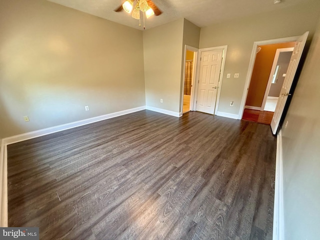 unfurnished bedroom featuring dark wood-type flooring and ceiling fan