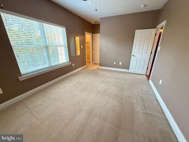 unfurnished bedroom with light carpet