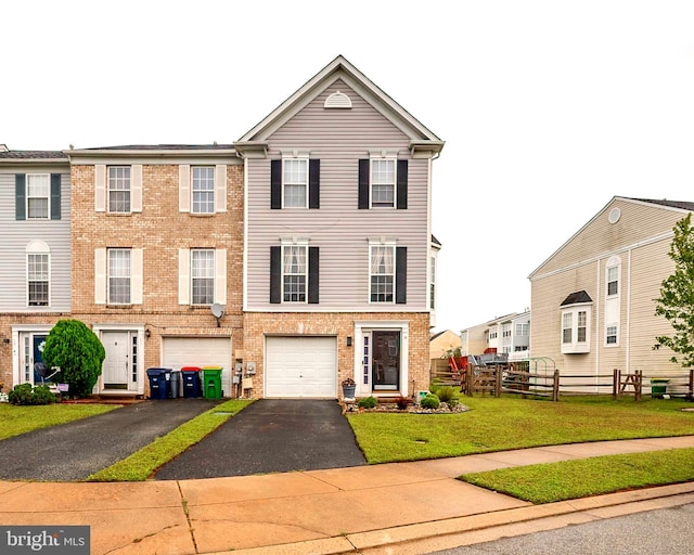 view of front of property featuring a garage and a front yard