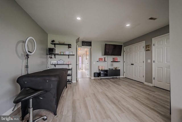 office with light hardwood / wood-style flooring