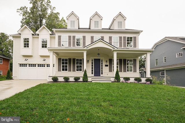 view of front of property featuring a porch, a garage, and a front yard