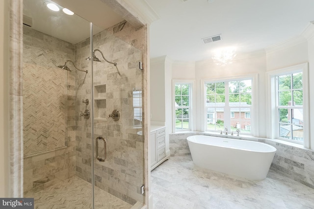 bathroom with a notable chandelier, crown molding, plenty of natural light, and separate shower and tub