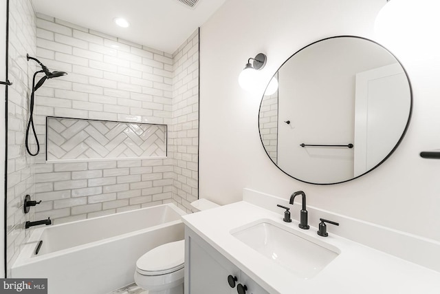 full bathroom featuring tiled shower / bath, vanity, and toilet