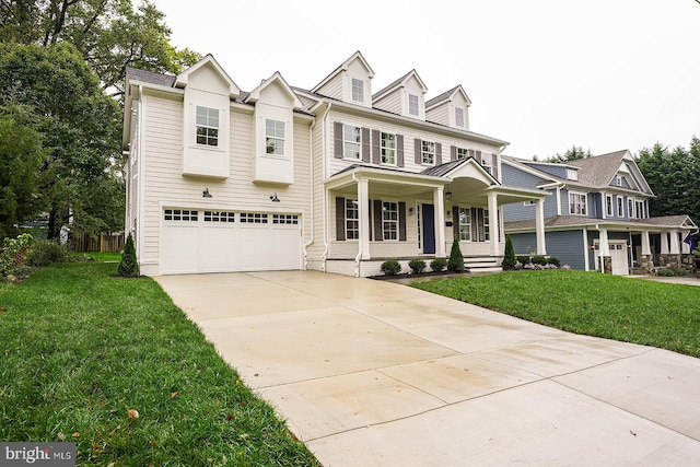 view of front facade featuring a garage, a front lawn, and covered porch