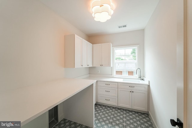 laundry area featuring sink