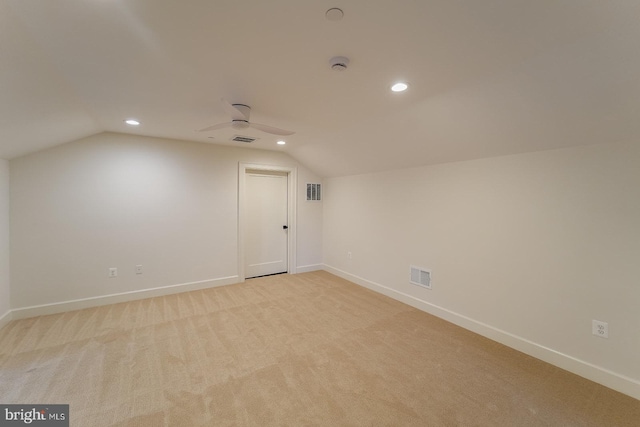 bonus room featuring light carpet and lofted ceiling