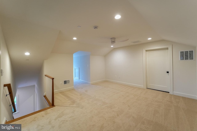 bonus room featuring light carpet, lofted ceiling, and ceiling fan