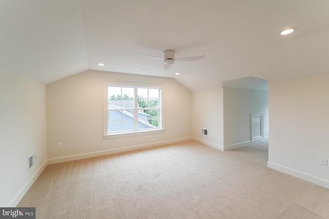 bonus room featuring vaulted ceiling, ceiling fan, and light carpet