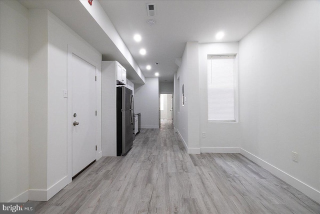 corridor featuring light hardwood / wood-style flooring