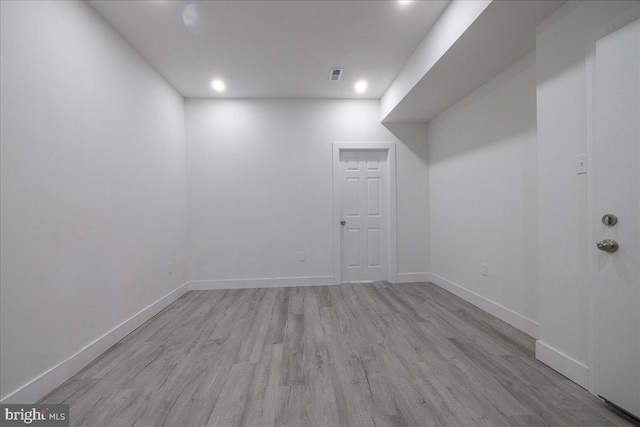 basement featuring light wood-type flooring