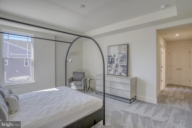 bedroom with light colored carpet