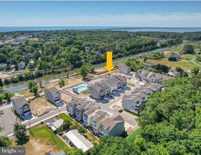 birds eye view of property with a water view