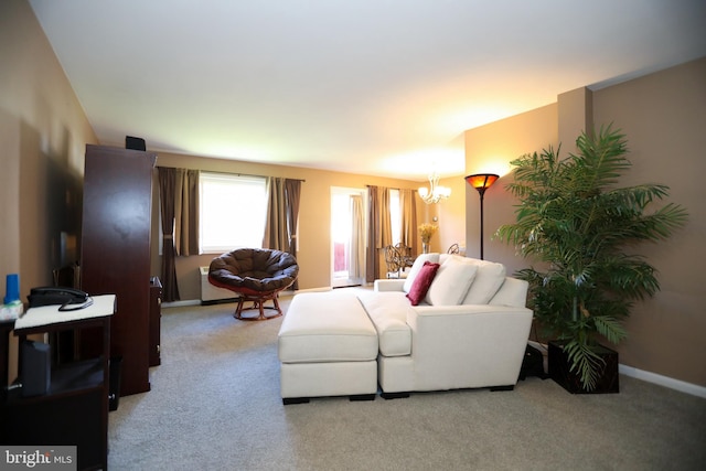 living room featuring light carpet and a chandelier