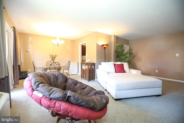 living room with carpet and a chandelier