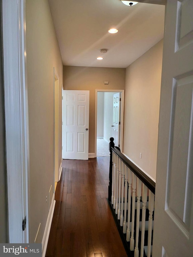 hall with dark wood-type flooring