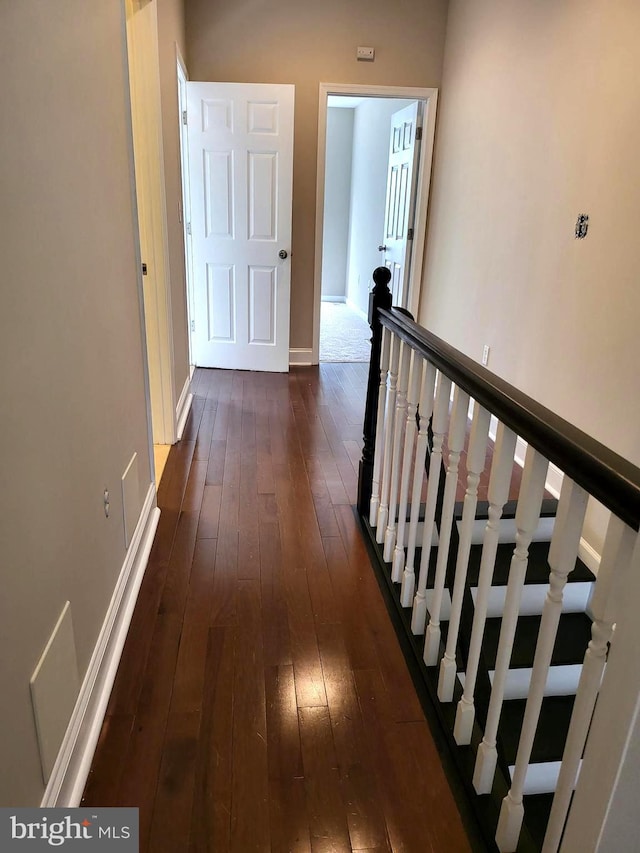 corridor featuring dark hardwood / wood-style floors