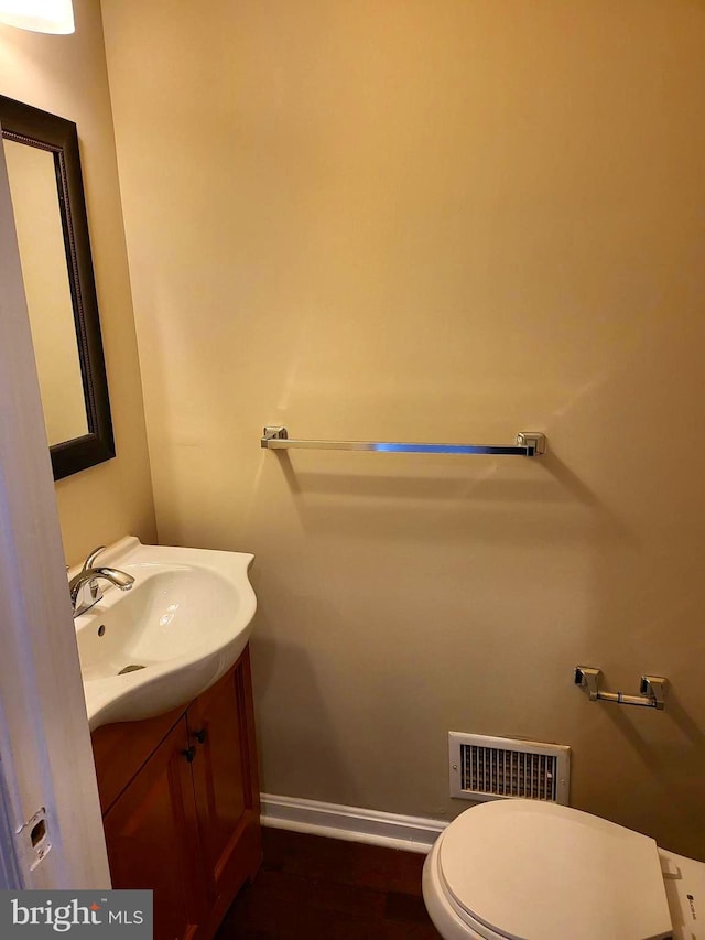 bathroom with vanity and toilet