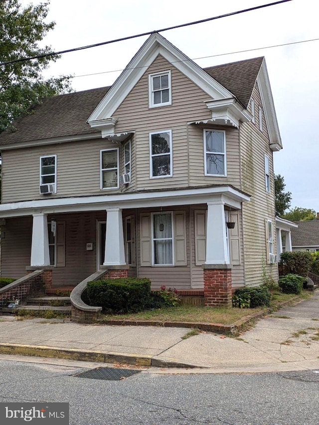 view of front of home featuring a porch and a shingled roof