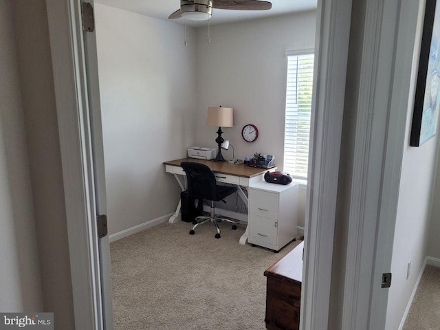 office featuring light carpet and ceiling fan