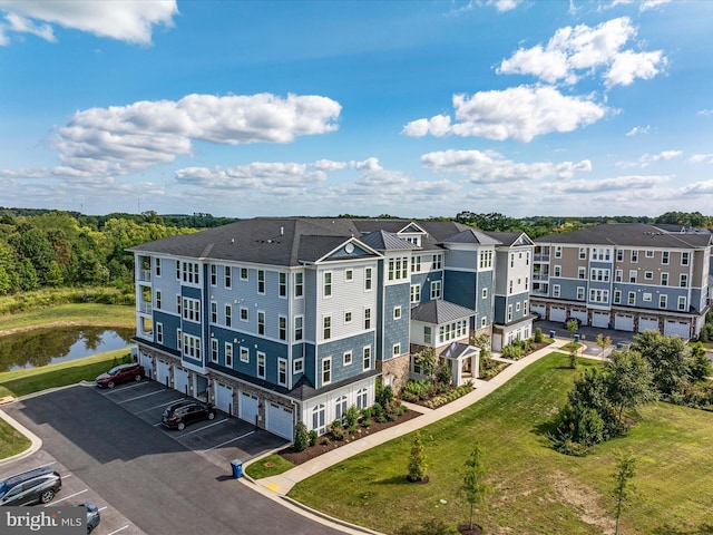 drone / aerial view featuring a water view