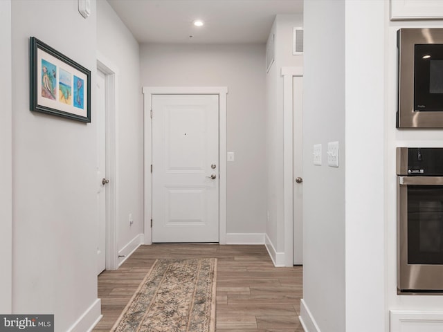 doorway featuring wood-type flooring