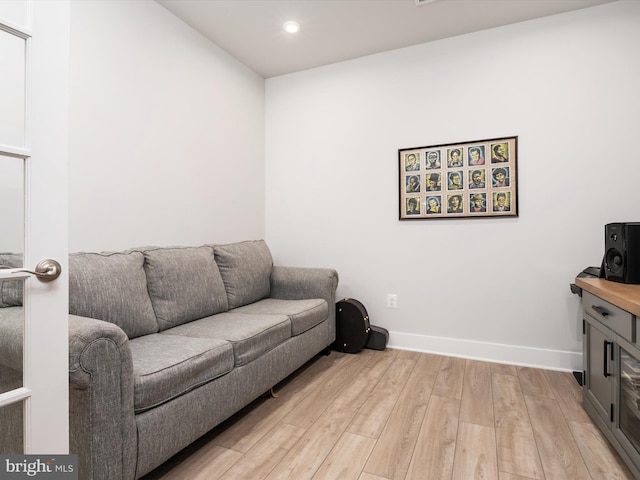 living room with light hardwood / wood-style flooring