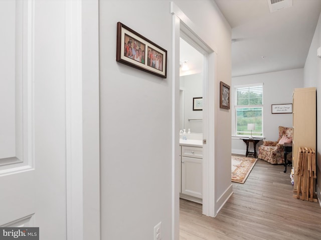 hallway with light wood-type flooring