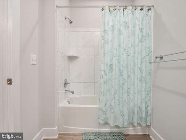 bathroom with shower / tub combo with curtain