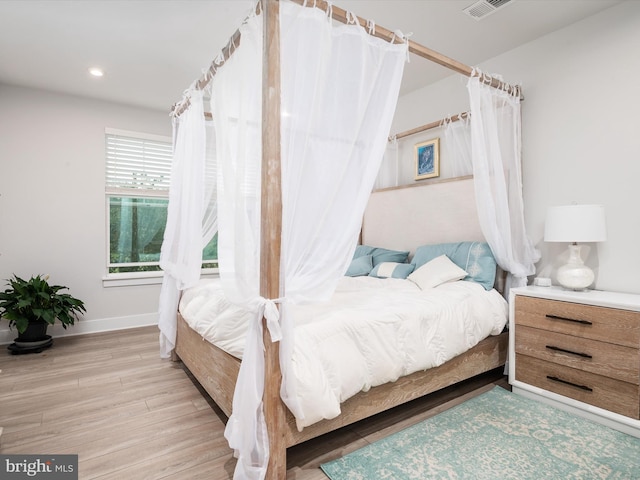 bedroom with light hardwood / wood-style flooring