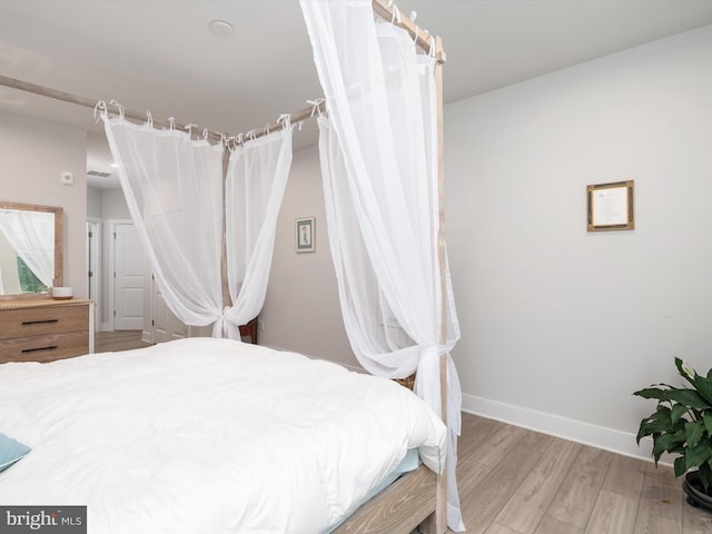 bedroom with light hardwood / wood-style flooring