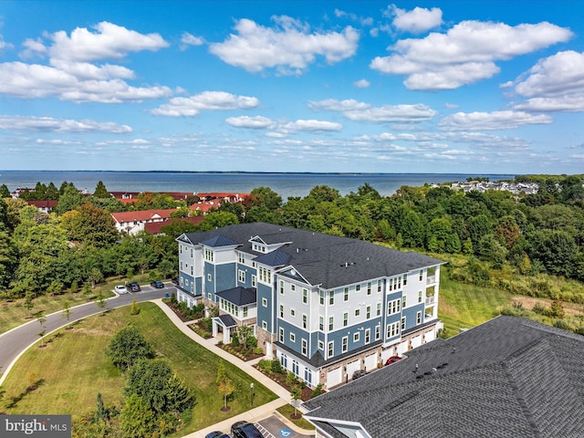 birds eye view of property featuring a water view