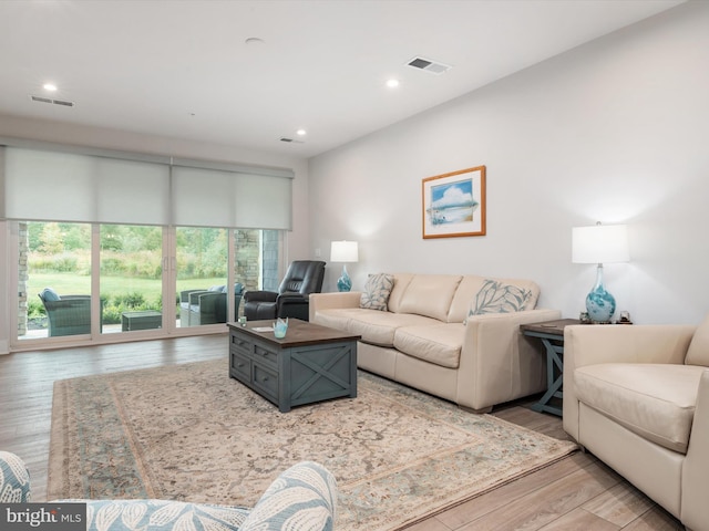 living room with light hardwood / wood-style floors