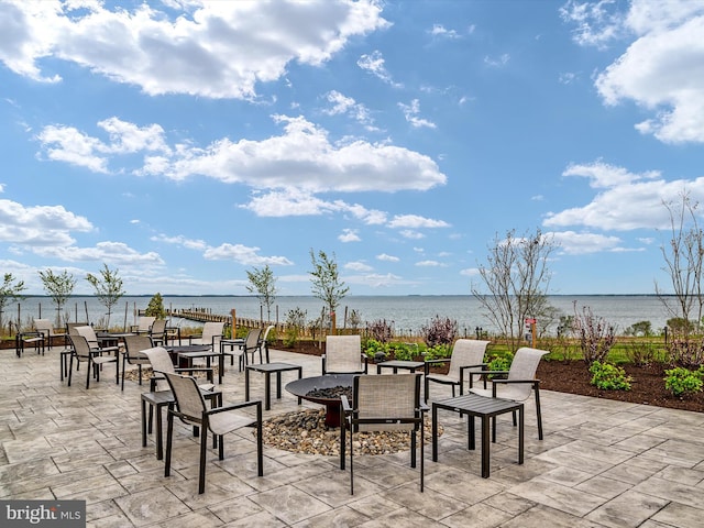 view of patio with a water view