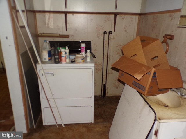 clothes washing area with washer / dryer