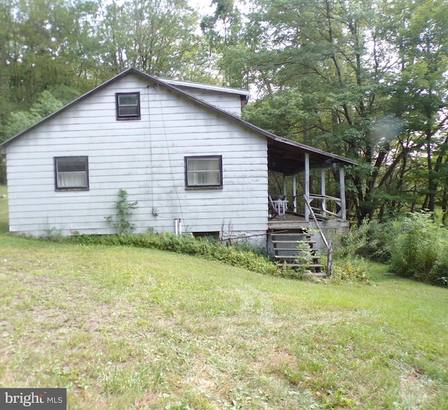 view of home's exterior featuring a lawn